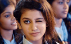 Priya Varriers wink helps Vadodara city police control road accidents in traffic safety Poster